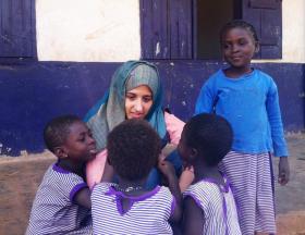 Besan Abu-Radwan, Haverford College '14, and students at Titagya Schools, Dalun, Ghana.