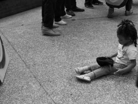 Little Girl sitting on ground